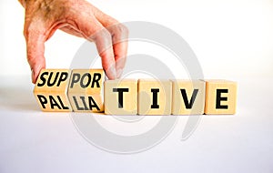 Palliative or supportive therapy symbol. Doctor turns cubes, changes words palliative to supportive. Beautiful white background,