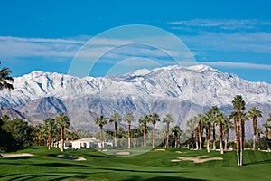 Palm Desert Desert Springs golf course mountains snow capped Palm trees