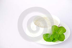 Palm fruit with syrup or fruto de palmeira in a separate bowl on white background. photo