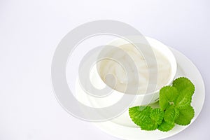 Palm fruit with syrup or fruto de palmeira in a separate bowl on white background. photo