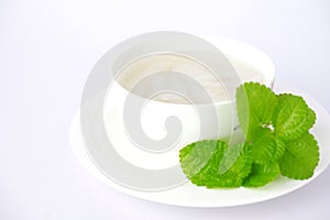 Palm fruit with syrup or fruto de palmeira in a separate bowl on white background. photo