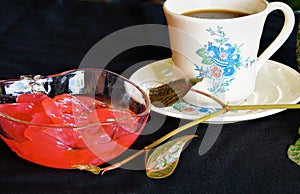 Palm fruits served in red syrups. and coffee.