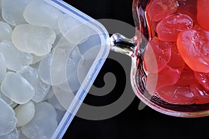 Palm fruits served in white and red syrups.