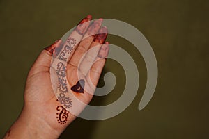 The palm of a girl with Mehandi design