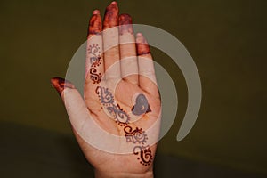 The palm of a girl with Mehandi design