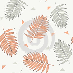 Palm green orange leaves on the white background. Seamless pattern with tropical plants.