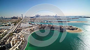 The Palm island with luxury villas and hotels in Dubai aerial view