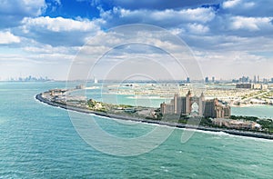 Palm Jumeirah island and Atlantis with Dubai skyline aerial view