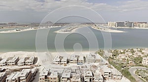 Palm Jumeirah Island in Dubai. Aerial view on a sunny afternoon