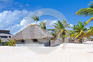 Palm leaf roof bungalow on the tropical beach