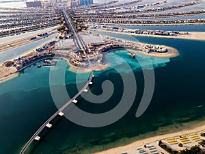 The Palm monorail track leading into the island in Dubai aerial