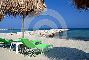 Palm parasol at summer beach photo