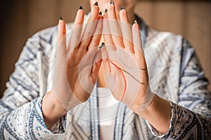 Palm reader, woman predict future on a hand