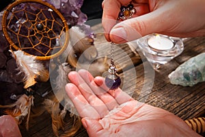 Palm reading with pendulum photo