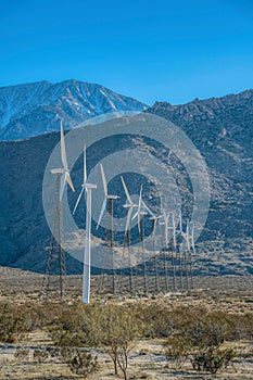 Palm Springs, California- Windmill tubular steel tower along with the windmills on lattice towers