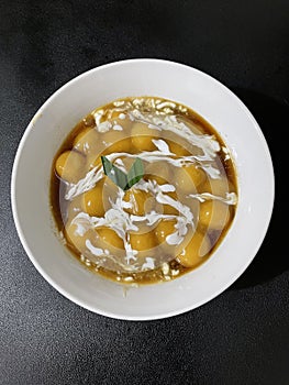 Palm sugar sweet candil porridge with coconut milk sauce photo
