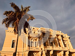 A palm tree in front of a beautiful museum in MÃÂ©rida - MEXICO - photo