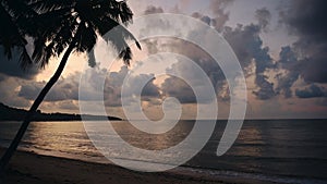 Palm Tree Sunset with Dramatic Clouds Over the Horizon and Ocean, Sea and Sky at Koh Samui, Thailand