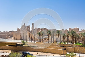 Palm trees and Ruins of Diraiyah, also as Dereyeh and Dariyya, a town in Riyadh, Saudi Arabia, was the original home of the Saudi photo