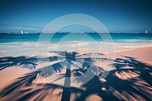 Palm trees shadow on the tropical beach Punta Cana, Dominican Re