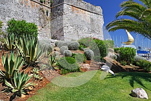 Palm trees and the wall of an ancient fortress, Cascais, Portugal