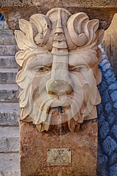 Palma de Mallorca, Spain - 7 Nov 2022: Gargoyle fountains on the steps of the Royal Palace of La Almudaina