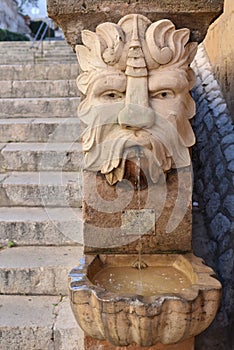 Palma de Mallorca, Spain - 7 Nov 2022: Gargoyle fountains on the steps of the Royal Palace of La Almudaina