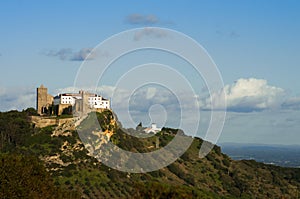 Palmela castle on top of the hill, under blue sky. Portugal photo