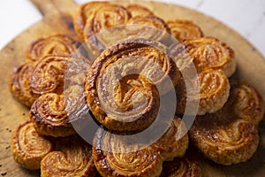 Puff pastry glasses or palmeritas made with baked sugar. photo
