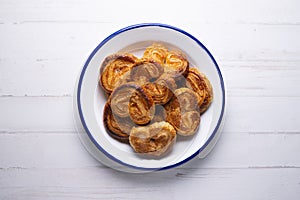 Puff pastry glasses or palmeritas made with baked sugar. photo