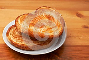 Palmier pastries on saucer photo