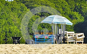 Palms parasols sun loungers beach resort Zicatela Puerto Escondido Mexico