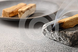 Palo Santo stick incense burning for aromatherapy.