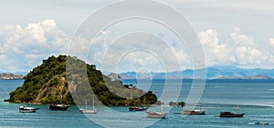 Palua Pungua Besar island and boats near Labuan Bajo, Flores, Indonesia photo