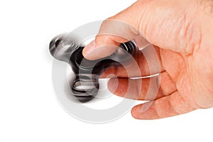 Palying with a Black Fidget Spinner