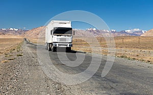 Pamir highway or pamirskij trakt and white truck