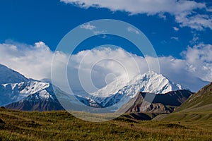 Pamir mountains cold snow ice glacier wall near Lenin peak