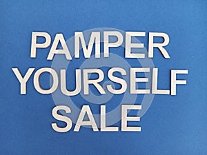 Pamper yourself sale sign on a blue background