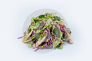Pan Asian meat salad with chicken fillet slices, several types of cabbage, parsley and salad mix isolated on background.
