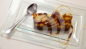 Pan de Calatrava with caramel and spoon, spanish pudding cake photo
