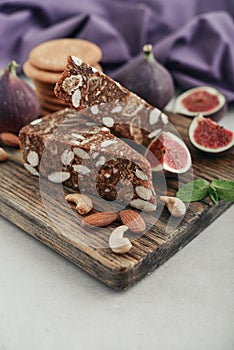 Pan de Higo - Spanish fig bread at wooden cutting board photo