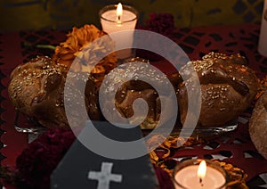 Traditional bread of the dead with sesame and marigold flowers photo
