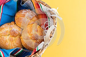 Pan de muerto in a wooden basket. Day of the dead. Mexican holiday