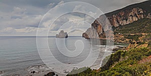 Pan di zucchero rock, limestone formation in front of masua beach photo