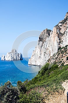 Pan di Zucchero rocks in the sea and Masua's sea stack (Nedida),