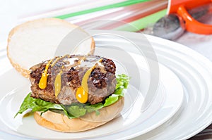 Pan fried burger with mustard and sesame dressings photo