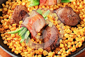 Pan fried chicken liver with sweetcorn and green beans in bacon