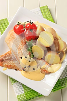 Pan fried fish fillets and potatoes