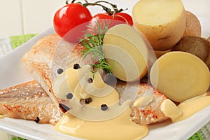 Pan fried fish fillets and potatoes