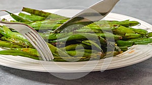 Pan fried French green beans Haricots Verts recipe. String beans close-up photo